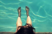 person's legs in a pool, pool algaecide