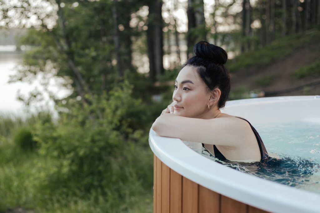 woman sitting in a portable hot tub